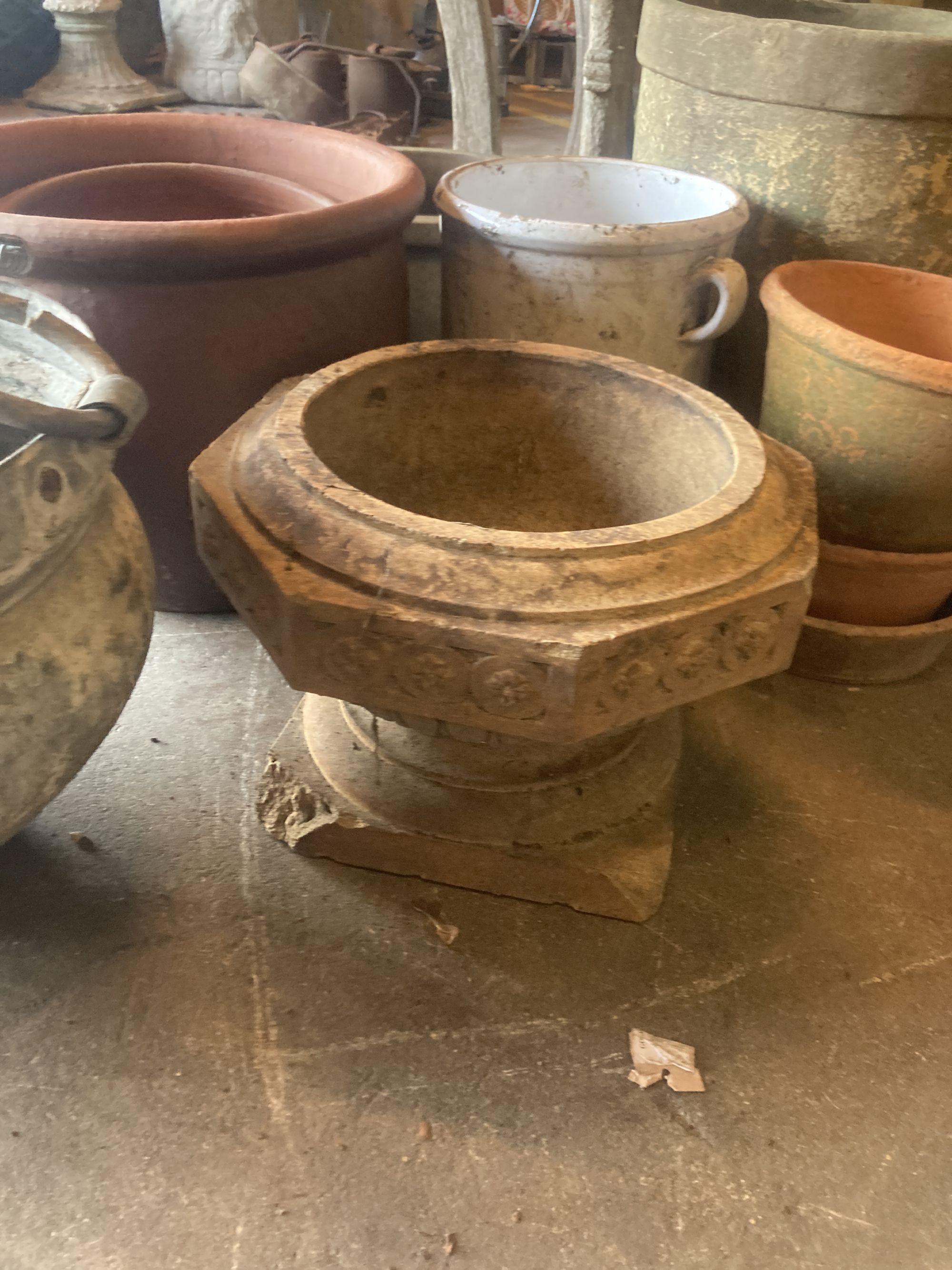 A quantity of assorted terracotta, glazed earthenware and metal garden planters together with a wirework basket, largest 40cm diameter